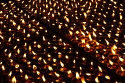 In the evening butter lamps create a solumn atmosphere.