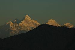 We rise early to witness the awakening of the peaks; within minutes they rise from the shade; turn orange and then white. The peak in the middle is Manaslu; a great trekking area which doesn't get many trekkers.