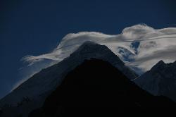 While climbing up to Gokyo Ri the black pyramid of Mount Everest creates bizarre clouds in the jetstream.