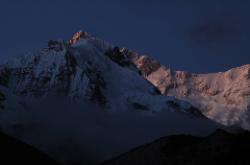 The very last seconds of the setting sun hit the eastern spur of Kangchenjunga.