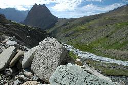 Mani stones with Bumiktse La and Singe Peak in the background; our destination for today.