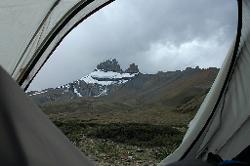 The weather does get worse; and the rainy afternoon is best spent in the tent with views of Singe Peak and its glaciers.