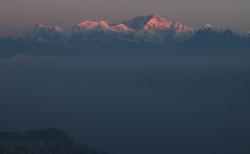 Darjeeling town lies in the shade while the highest peaks of the massif have already caught the light.