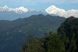 Kangchenjunga rises about the lush green forest and valleys near Gangtok.